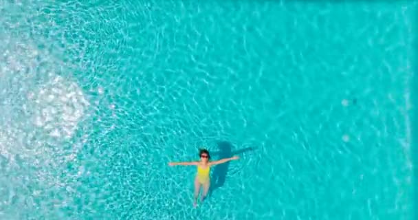 Top View Woman Yellow Swimsuit Lying Her Back Pool Relaxing — 图库视频影像