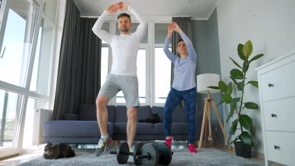 Caucasian Couple Doing Cardio Training Home Cozy Bright Room Slow — ストック動画