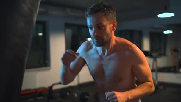 Alone Male Boxer Working Out Blows Punching Bag Gym Evening — 图库视频影像