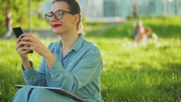 Woman Using Smartphone While Sitting Park Finishing Outdoor Work Sunset — Stock Video
