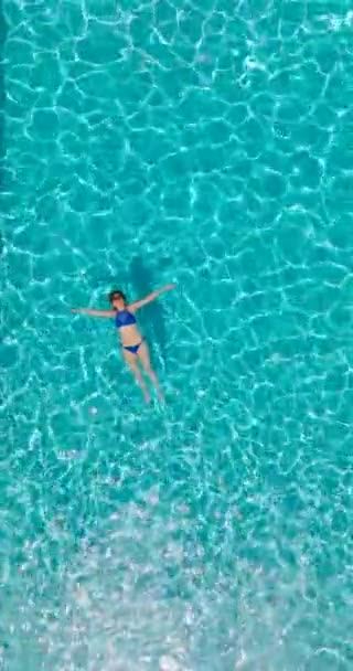 Vertical Video Top View Woman Blue Swimsuit Lying Her Back — Stockvideo