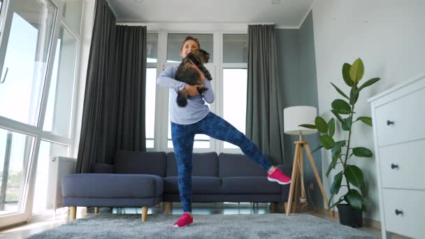 Woman Squats Fluffy Cat Her Arms Slow Motion Home Workouts — Stock videók
