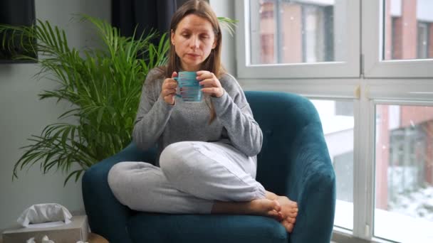 Unhealthy Caucasian Woman Sits Chair Drinks Hot Tea Cold Medicine — стоковое видео