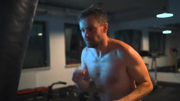Alone Male Boxer Working Out Blows Punching Bag Gym Evening — Stok video