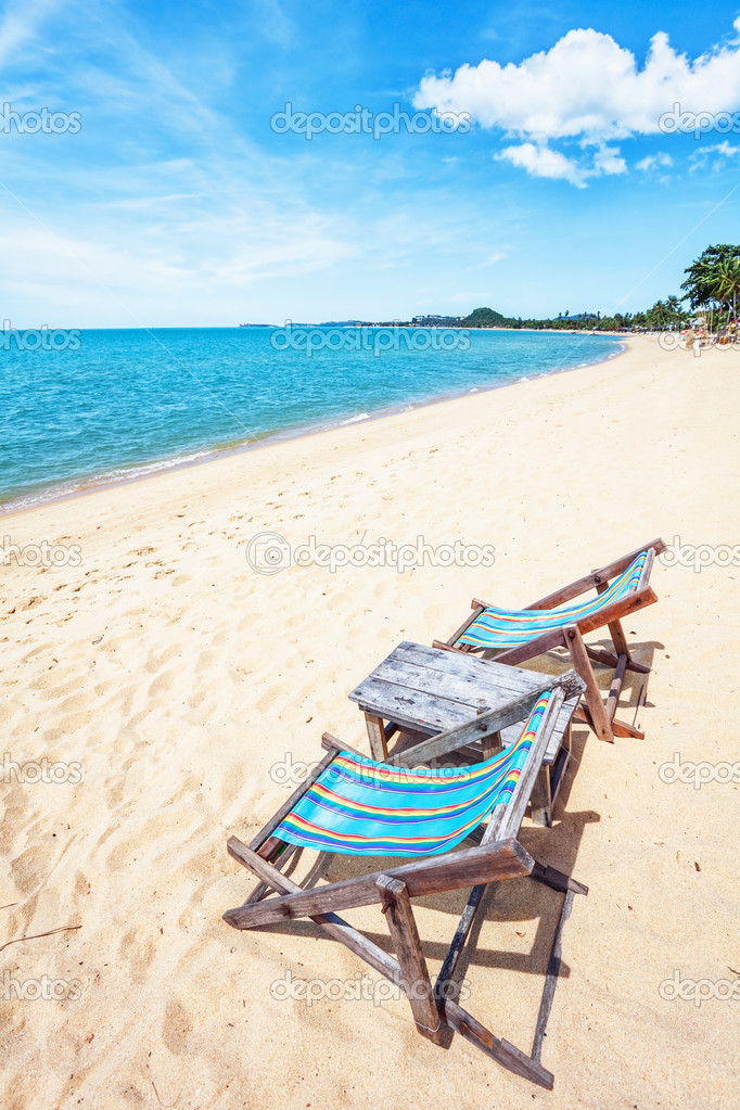 sun beach chair on shore near sea