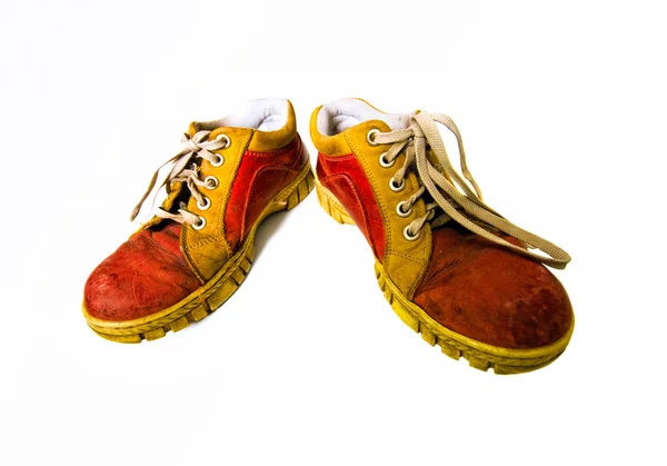 Alte rote schmutzige Stiefel — Stockfoto