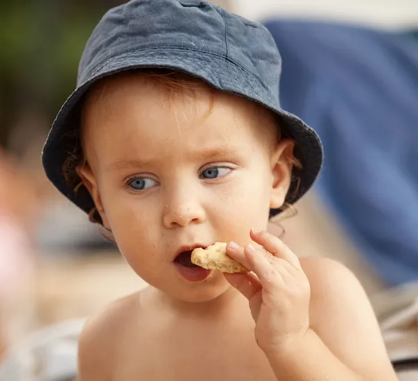 Little boy eating a cookie — Stock Photo, Image