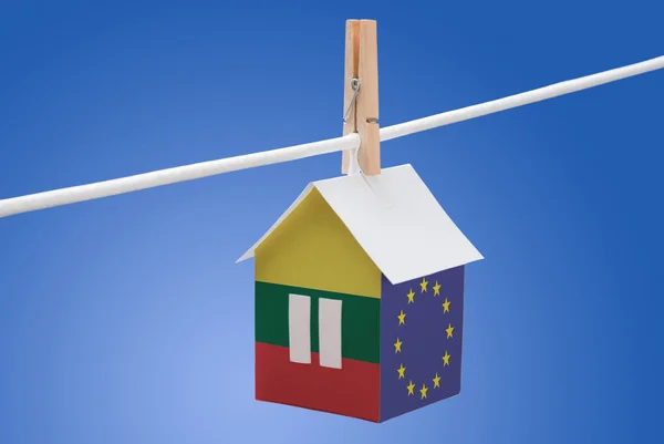 Lithuania, Lithuanian and EU flag on paper house — Stock Photo, Image