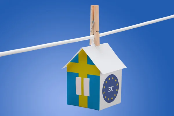 Sweden, swedish and EU flag on paper house — Stock Photo, Image