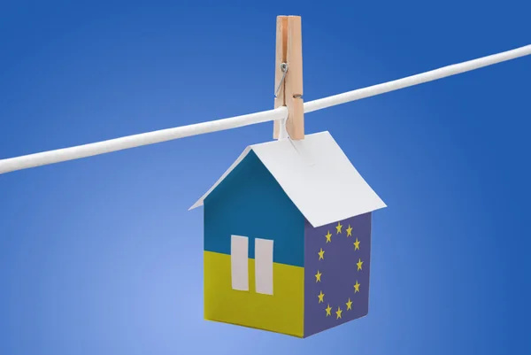 Ukraine, Ukrainian and EU flag on paper house — Stock Photo, Image