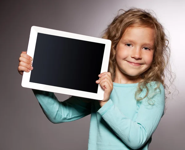 Gelukkig meisje met tablet pc Stockfoto