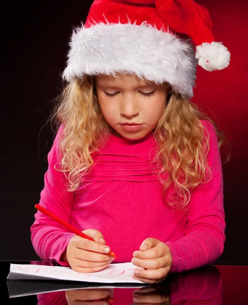 Fille écrit une lettre au Père Noël claus — Photo