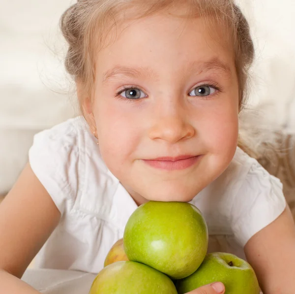 Child with apples Stock Image