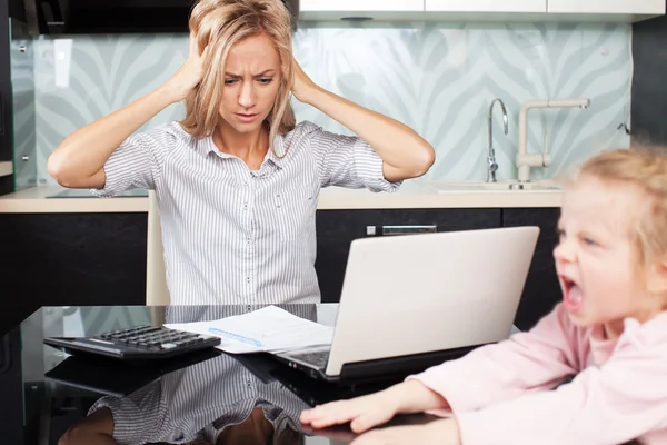 Sad woman looks at the bill — Stock Photo, Image