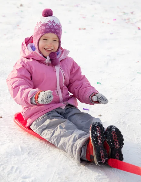 Girl on sled — Stock Photo, Image