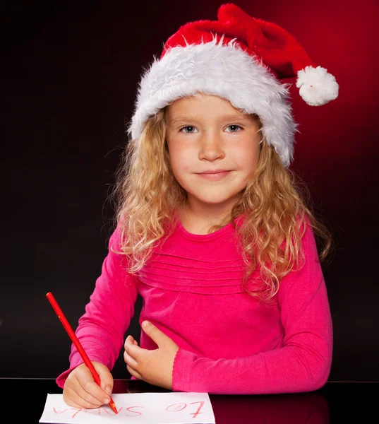 Fille écrit une lettre au Père Noël claus — Photo