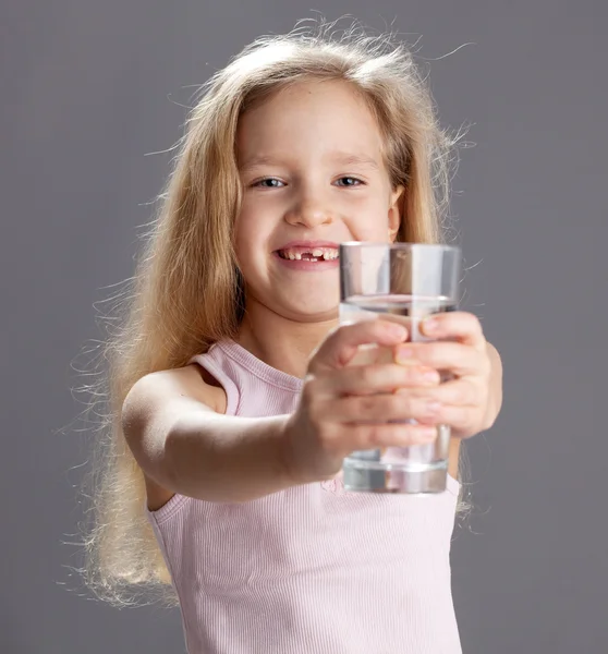 Girl drinking water from glass Stock Image