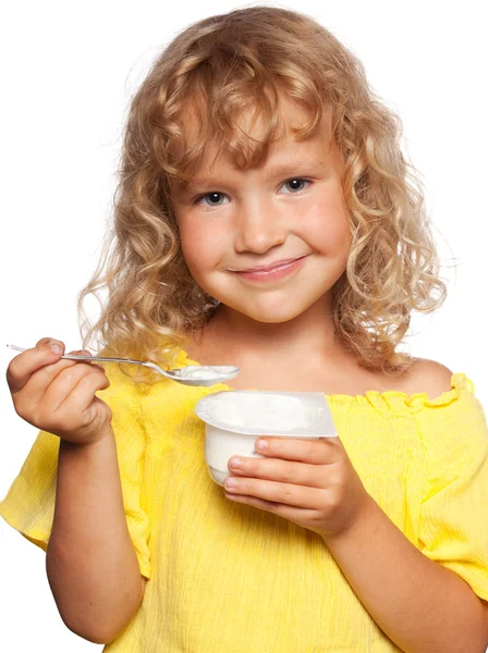 Little girl eating yogurt — Stock Photo, Image