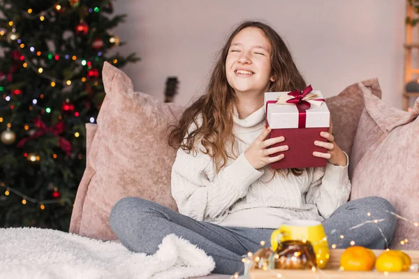 Happy Surprised Teen Girl Holding Her Christmas Gift — Stock Photo, Image