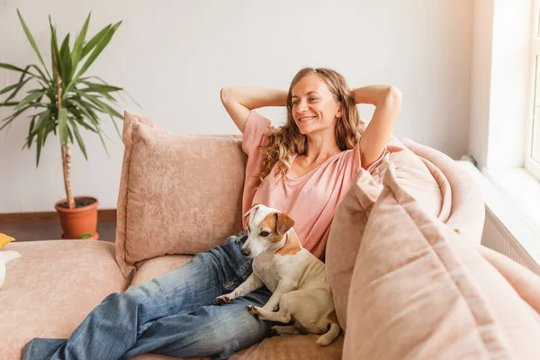 Serene Young Woman Pretty Relaxing Couch Living Room Dog Calm — Stockfoto