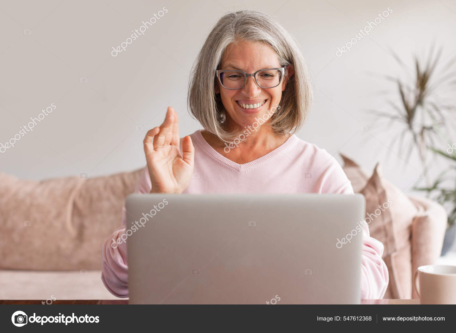 https://st.depositphotos.com/1003377/54761/i/1600/depositphotos_547612368-stock-photo-happy-middle-aged-woman-making.jpg