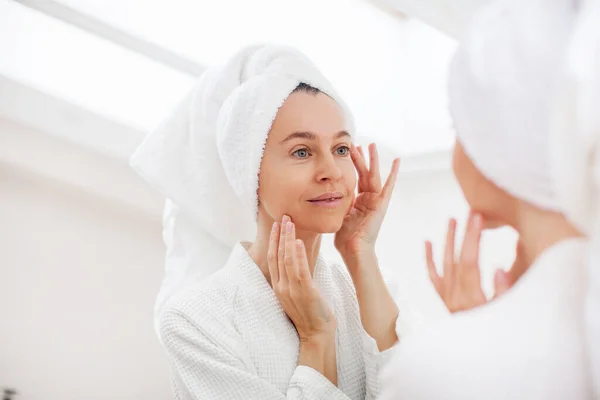 Closeup Portrait Gorgeous Happy Middle Age Woman Looking Mirror Touching Royalty Free Stock Photos