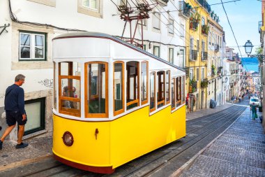 LISBON, PORTUGAL - SEPTEMBER 2, 2017: View to yellow streetcar the Bica Funicular (Ascensor de Bica) railway line