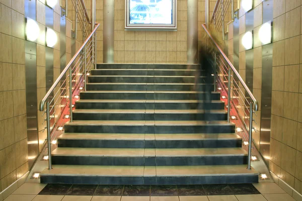 Wide staircase with moving person — Stock Photo, Image