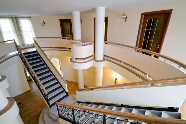 Interior of new mansion with staircase and balcony indoors — Stock Photo, Image