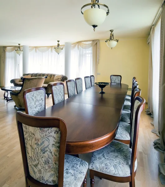 Interior of living room with big table for dinner — Stock Photo, Image