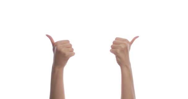 Close-up of female hands raising a thumb up on a white background. Isolated. — Stock Video