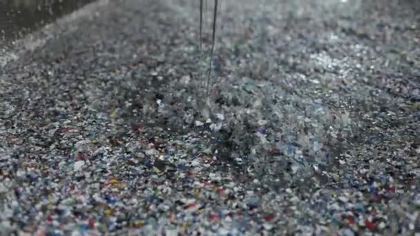 Recycling plastic by dissolving in a metal container. A large amount of crushed plastic is into a special liquid. Top view. — Stock videók