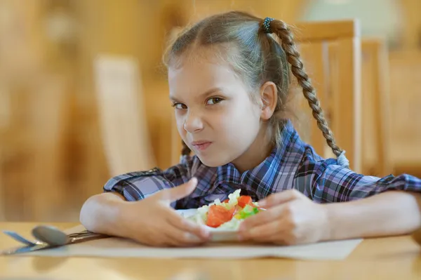 Little girl does not want to share meal — Stock Photo, Image