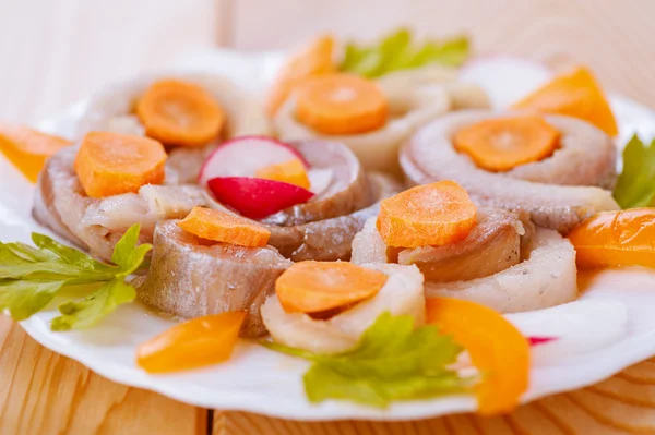Herring, coiled with carrots and parsley — Stock Photo, Image