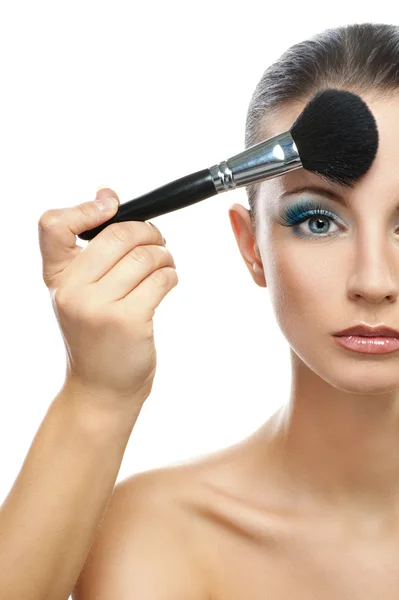 Makeup artist prepares forehead woman Stock Image