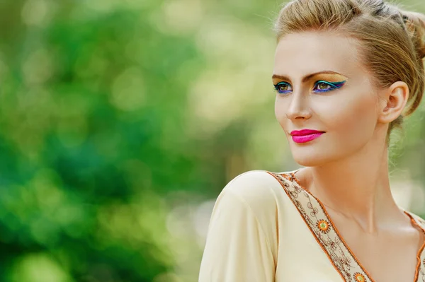 Beautiful young woman in yellow dress — Stock Photo, Image