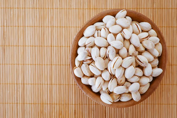 Salted peanuts in wooden bowl — Stock Photo, Image