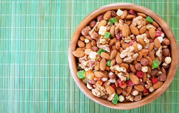 Wooden plate with variety of ingredients — Stock Photo, Image