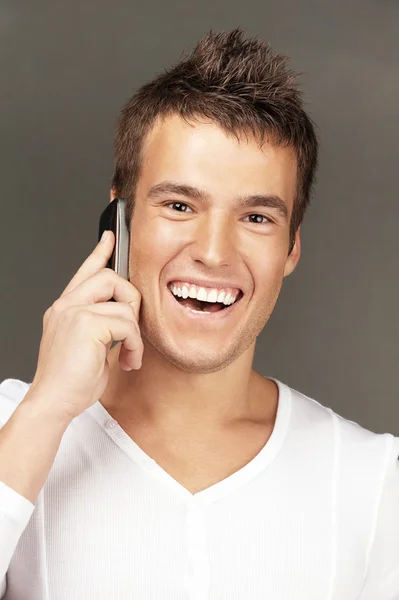 Handsome man calls by telephone Stock Image