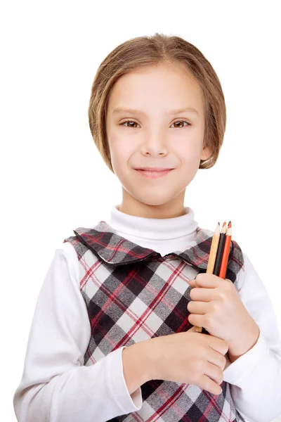 Lächelndes kleines Mädchen mit Bleistiften — Stockfoto