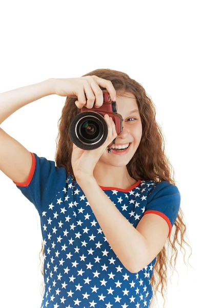 Leende liten flicka i stjärnor i klänning med kamera — Stockfoto