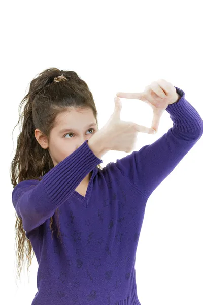 Smiling schoolgirl simulates camera photographing — Stock Photo, Image