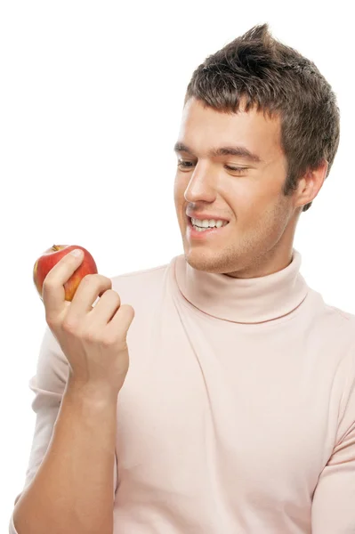 Portrait of young man holding red apple — Stock Photo, Image