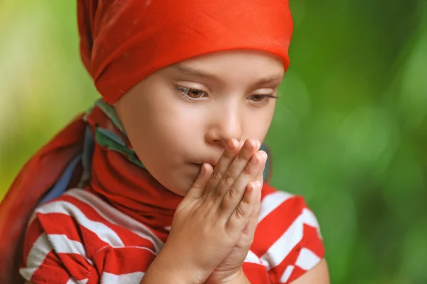 Small, sad little girl looking down — Stock Photo, Image