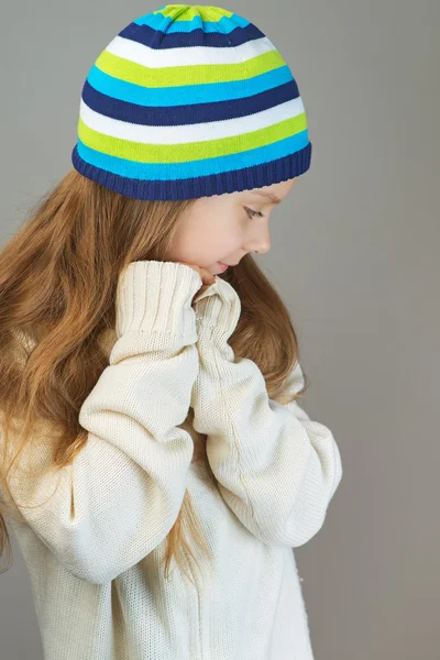 Smiling little girl in knitted cap — Stock Photo, Image