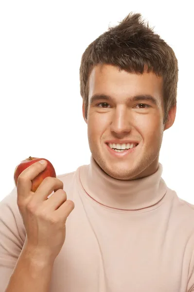 Portrait of young man holding red apple — Stock Photo, Image