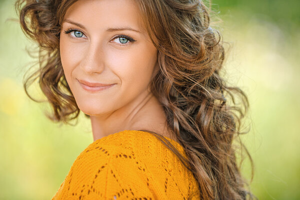 woman close-up in orange sweater