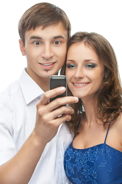 Beautiful couple reading sms on phone — Stock Photo, Image