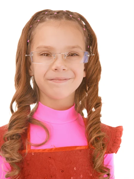 Little girl in pink dress sly smile — Stock Photo, Image