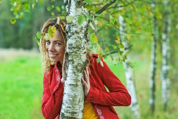 Woman with dreadlocks near birch — Stock Photo, Image